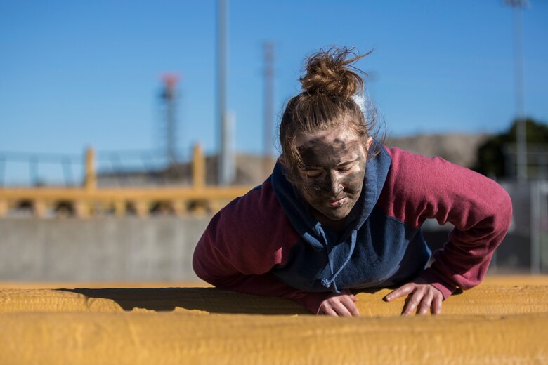 U.S. Marines assigned to Marine Aviation Logistics Squadron (MALS) 13 and their spouses participate in Jane Wayne Day at Marine Corps Air Station (MCAS) Yuma Jan. 25, 2019. Jane Wayne Day consisted of applying camouflage paint, getting some "drill instructor time", conducting a modified combat fitness test (CFT), going through the Obstacle Course, learning a few Marine Corps Martial Arts Program (MCMAP) techniques, and shooting the Beretta M9 Pistol. Jane Wayne Day is designed to give the spouses a little insight on some of the things their Marine does while having fun. (U.S. Marine Corps photo by Cpl. Sabrina Candiaflores)