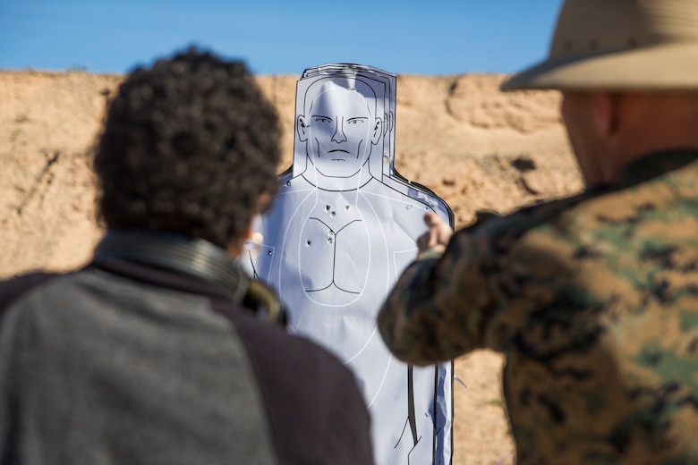 U.S. Marines assigned to Marine Aviation Logistics Squadron (MALS) 13 and their spouses participate in Jane Wayne Day at Marine Corps Air Station (MCAS) Yuma Jan. 25, 2019. Jane Wayne Day consisted of applying camouflage paint, getting some "drill instructor time", conducting a modified combat fitness test (CFT), going through the Obstacle Course, learning a few Marine Corps Martial Arts Program (MCMAP) techniques, and shooting the Beretta M9 Pistol. Jane Wayne Day is designed to give the spouses a little insight on some of the things their Marine does while having fun. (U.S. Marine Corps photo by Cpl. Sabrina Candiaflores)