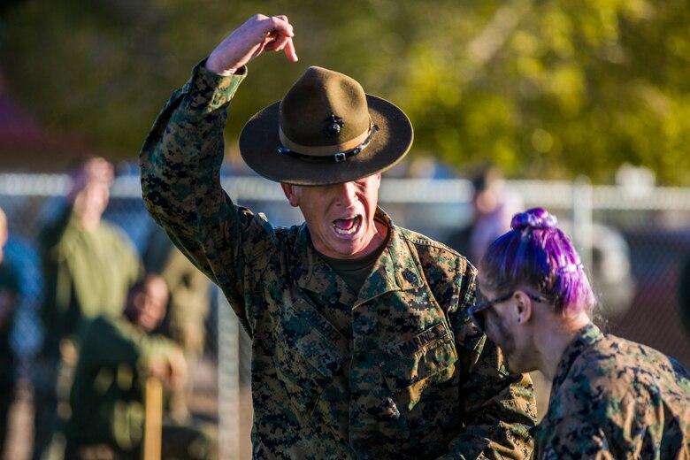 U.S. Marines assigned to Marine Aviation Logistics Squadron (MALS) 13 and their spouses participate in Jane Wayne Day at Marine Corps Air Station (MCAS) Yuma Jan. 25, 2019. Jane Wayne Day consisted of applying camouflage paint, getting some "drill instructor time", conducting a modified combat fitness test (CFT), going through the Obstacle Course, learning a few Marine Corps Martial Arts Program (MCMAP) techniques, and shooting the Beretta M9 Pistol. Jane Wayne Day is designed to give the spouses a little insight on some of the things their Marine does while having fun. (U.S. Marine Corps photo by Cpl. Sabrina Candiaflores)