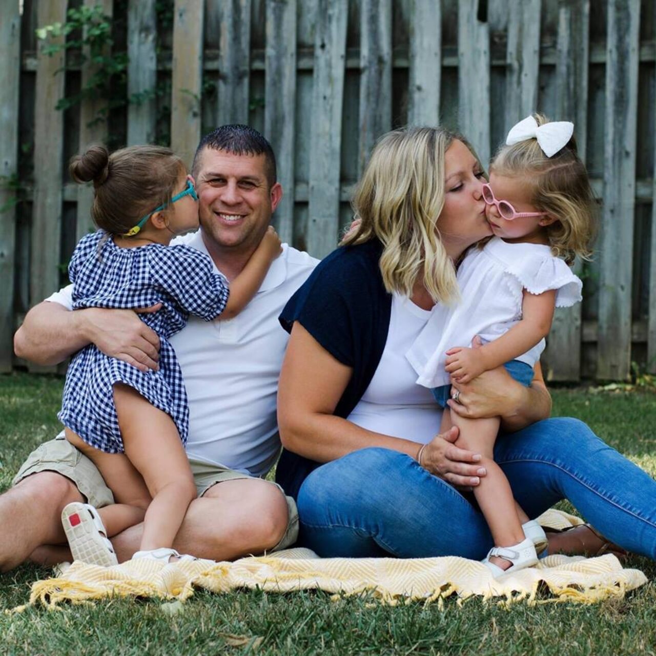 Soldier and wife pose with daughters