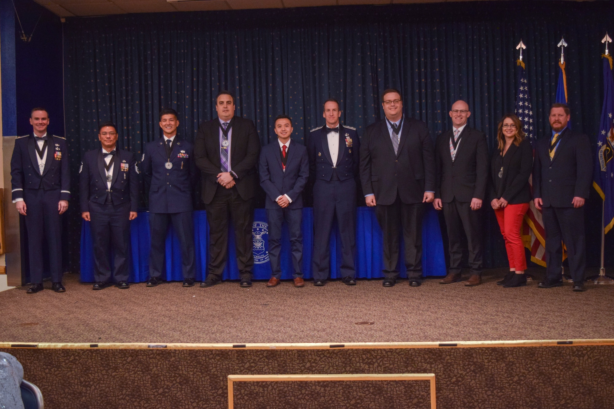 The Air Force Nuclear Weapons Center commander, Maj. Gen. Shaun Morris, congratulates the center’s annual award winners at a ceremony on Jan. 24, 2019, at the Mountain View Club, Kirtland AFB, New Mexico.  Pictured left to right:  Maj. Allen DeNeve, Master Sgt. Brandon Tanaka, Technical Sgt. Donald DeRusha, Michael Hall, Khoa Dinh, Maj. Gen. Shaun Morris, Keith Lucas, Robert Watson, Katie Peterson and William Schanke.  See story for complete list of winners. (Courtesy photo)