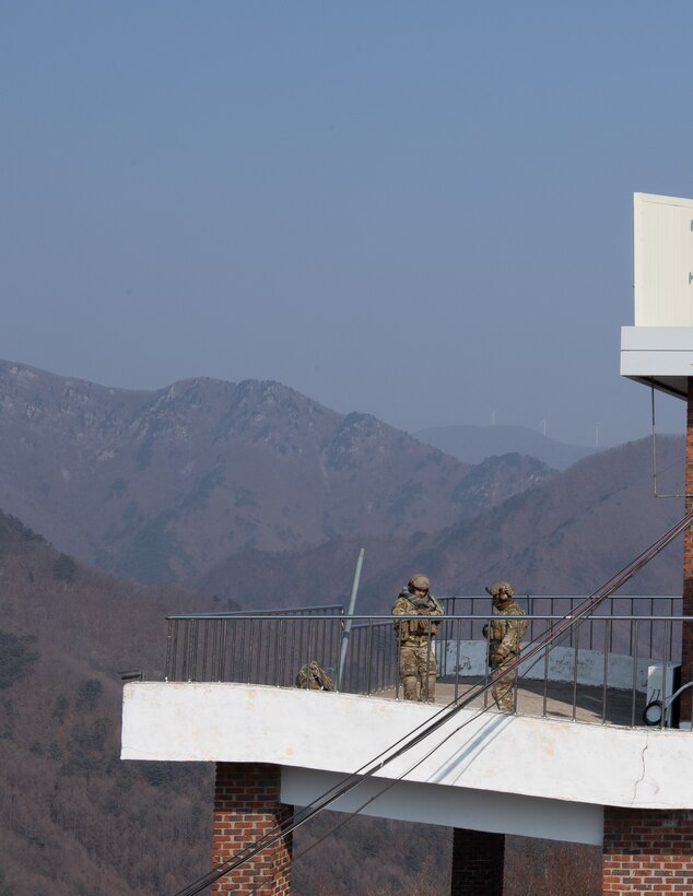 Two joint terminal attack controllers assigned to the 604th Air Support Operations Squadron and 607th Air Support Operations Group prepare for close air support training at the Pilsung Range Gangwan Province, Republic of Korea, Feb. 14, 2019.