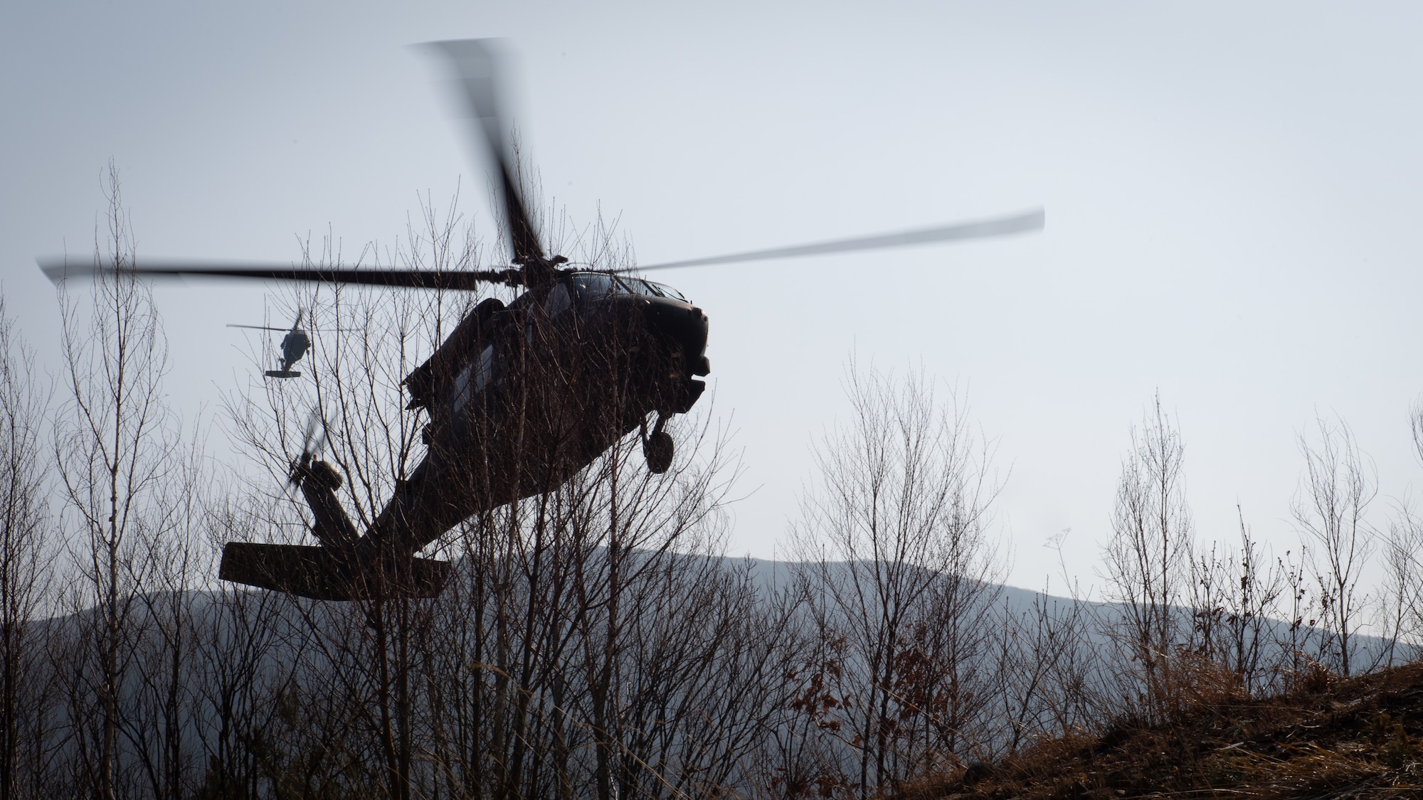 Two UH-60 Blackhawks land at Pilsung Range for joint terminal attack controller training with Airmen from the 604th Air Support Operations Squadron and 607th Air Support Operations Group in Gangwan Province, Republic of Korea, Feb. 14, 2019.