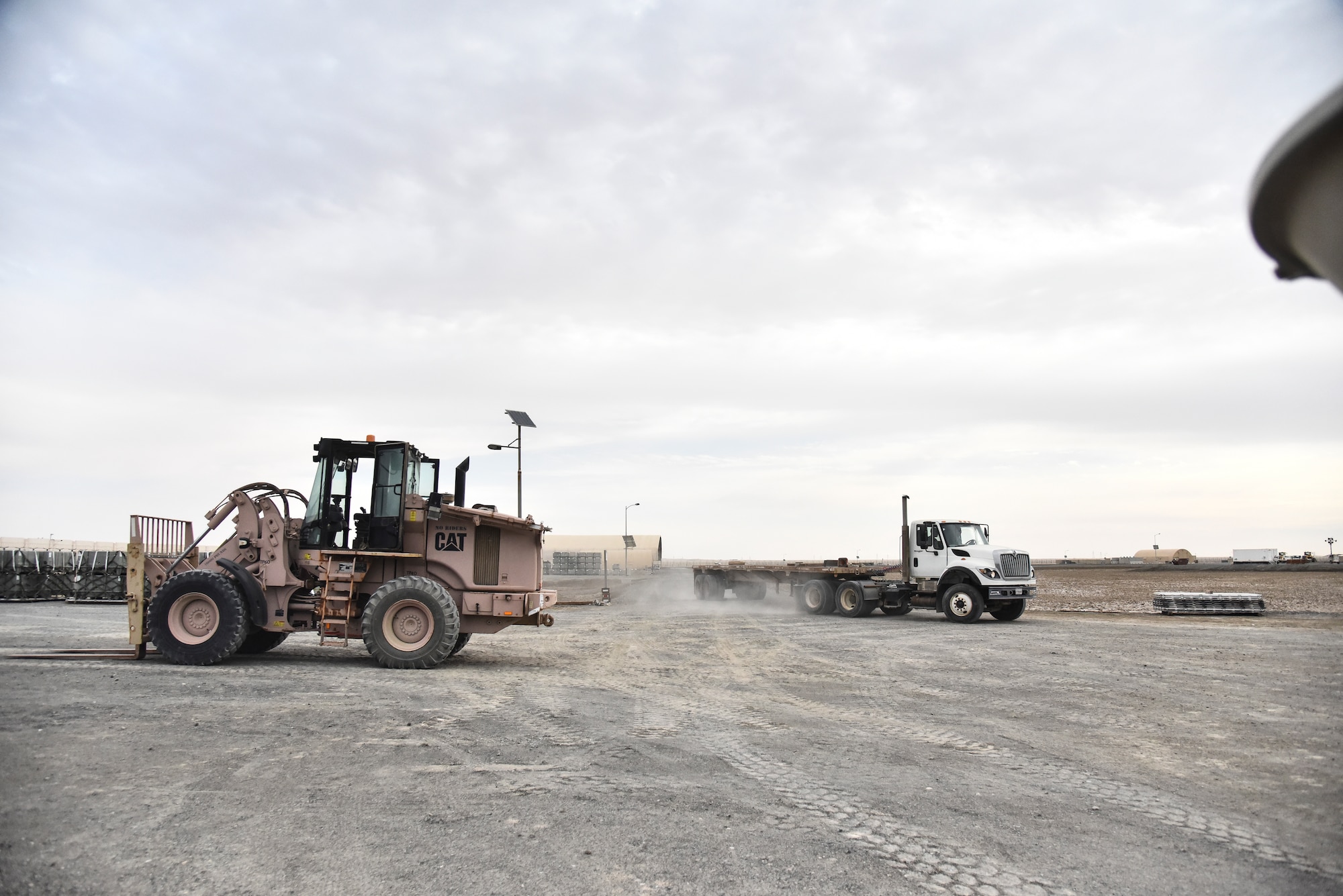 Airmen assigned to the 380th Expeditionary Maintenance Squadron munitions flight prepare to load guiding sections with a 10k forklift at Al Dhafra Air Base, United Arab Emirates, Feb. 15, 2019. Munitions systems specialists perform and manage munitions production and material tasks and activities; identify munitions and equipment requirements; operate and maintain automated data processing equipment (ADPE) to perform munitions accounting, computations, and research; stores, maintains, assembles, issues, and delivers assembled nonnuclear munitions. (U.S. Air Force photo by Senior Airman Mya M. Crosby)