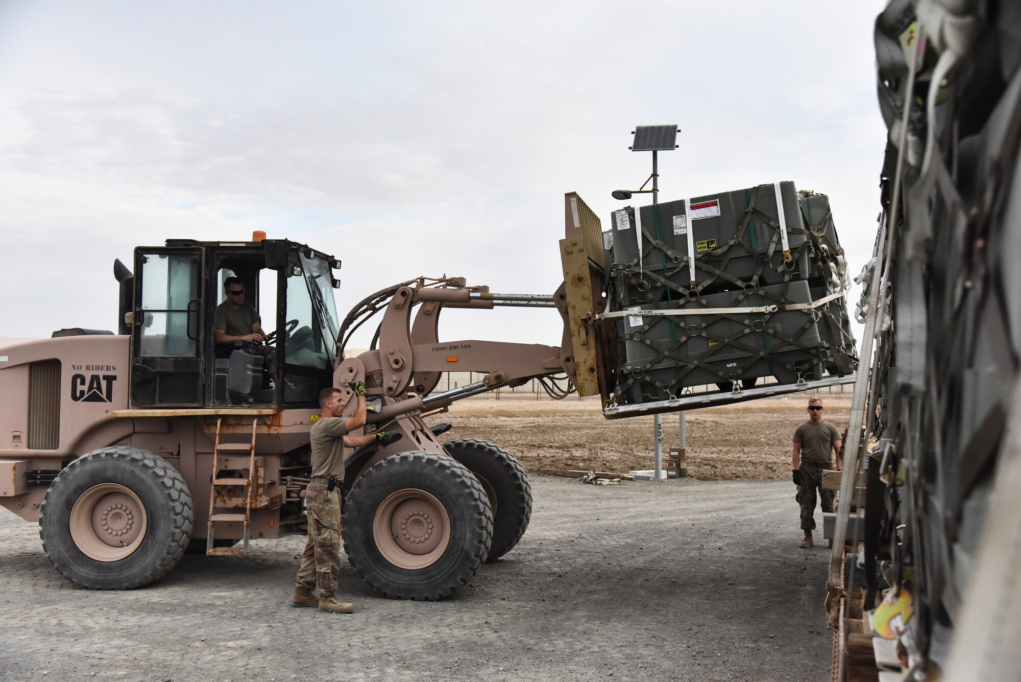 Airmen assigned to the 380th Expeditionary Maintenance Squadron munitions flight, load guiding sections at Al Dhafra Air Base, United Arab Emirates, Feb. 15, 2019. The 380th EMXS munitions flight, also known as Ammo flight, is a 10-man team has heavily supported the 380th Expeditionary Civil Engineer Squadron Explosive Ordnance Disposal flight, 380th Expeditionary Security Forces Squadron K-9 unit, Army Search and Rescue, Navy SEAL Teams, Coalition Forces and host nation forces through the U.S. Central Command’s area of responsibility. (U.S. Air Force photo by Senior Airman Mya M. Crosby)