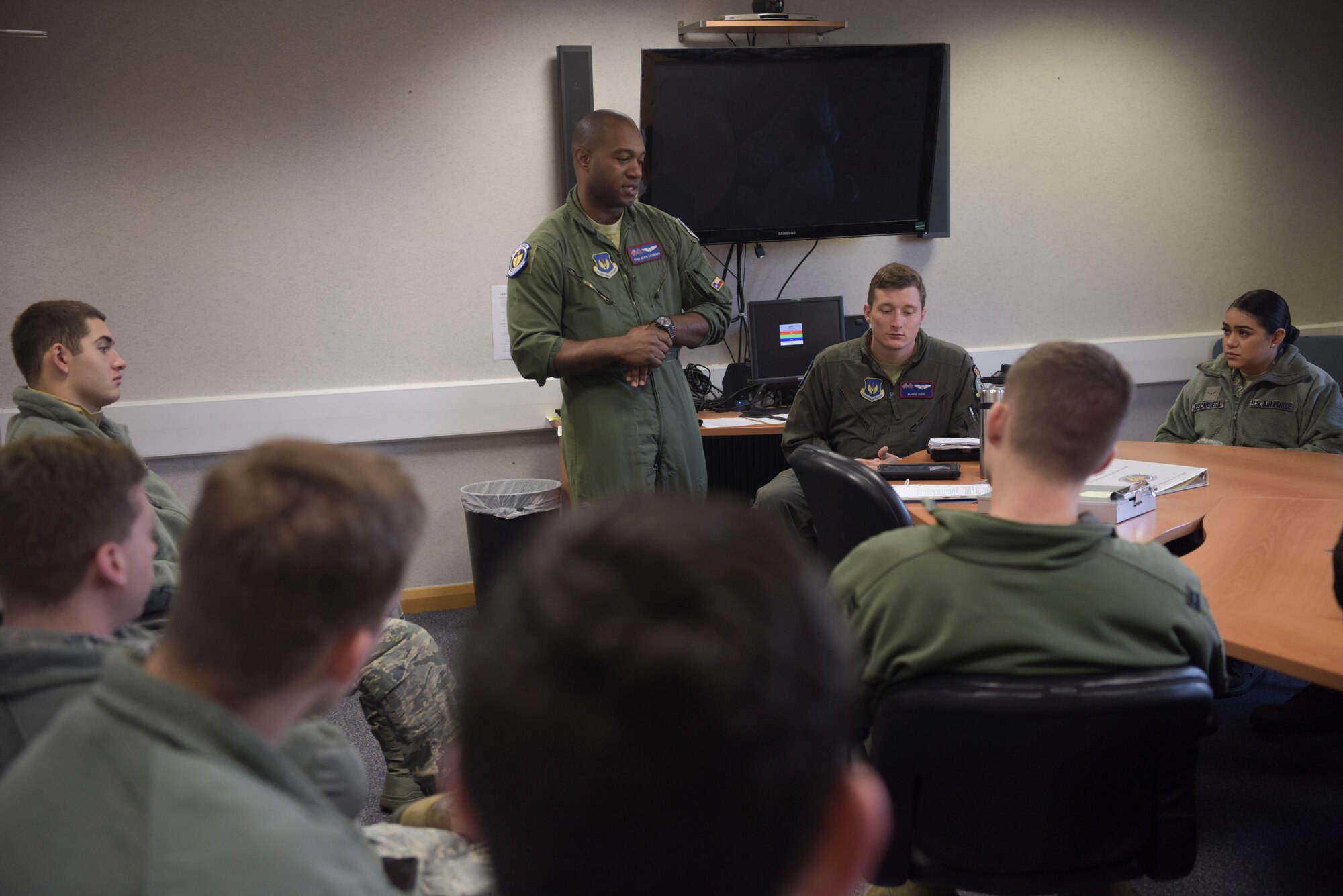 U.S. Air Force Staff Sgt. Kevin Satberry, 351st Air Refueling Squadron boom operator, gives a safety brief to First-Term Airmen before their incentive flight on a KC-135 Stratotanker at RAF Mildenhall, England, Feb. 2, 2019. Satberry uses these opportunities to answer any questions or concerns young Airmen may have before their first flight on a military aircraft. (U.S. Air Force photo by Airman 1st Class Alexandria Lee)