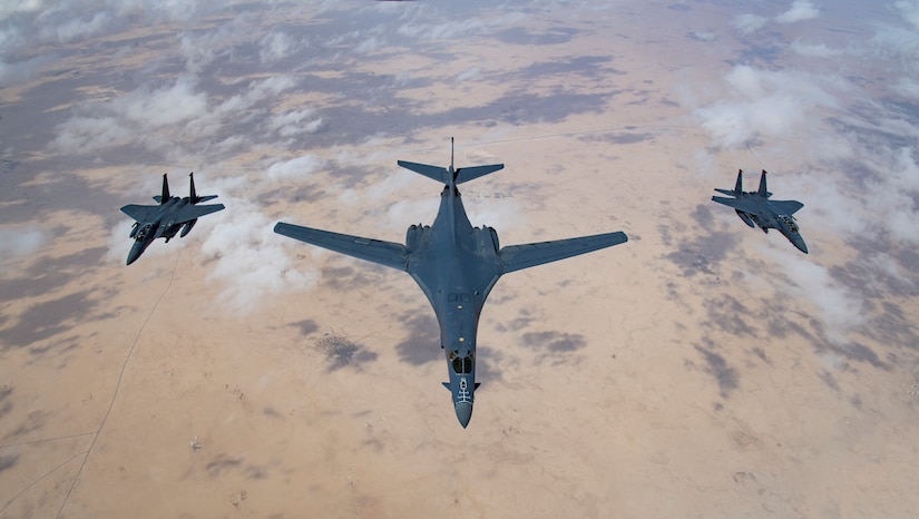 A U.S. Air Force B-1B Lancer bomber and F-15E Strike Eagles fly in formation during Joint Air Defense Exercise 19-01, Feb. 19, 2019. The aircraft participated in the flying portion of the combined defense exercise with regional partners to practice command and control tactics, techniques and procedures. JADEX is an opportunity to test and improve combined air and missile defense capabilities and ensure Joint Coalition partners are prepared to defend against external threats with a variety of capabilities and assets. (U.S. Air Force photo by Staff Sgt. Clayton Cupit)