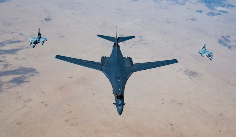 A U.S. Air Force B-1B Lancer bomber and Qatari Mirage 2000s fly in formation during Joint Air Defense Exercise 19-01, Feb. 19, 2019. The aircraft participated with regional partners to test objective-based command and control actions during the exercise. (U.S. Air Force photo by Staff Sgt. Clayton Cupit)