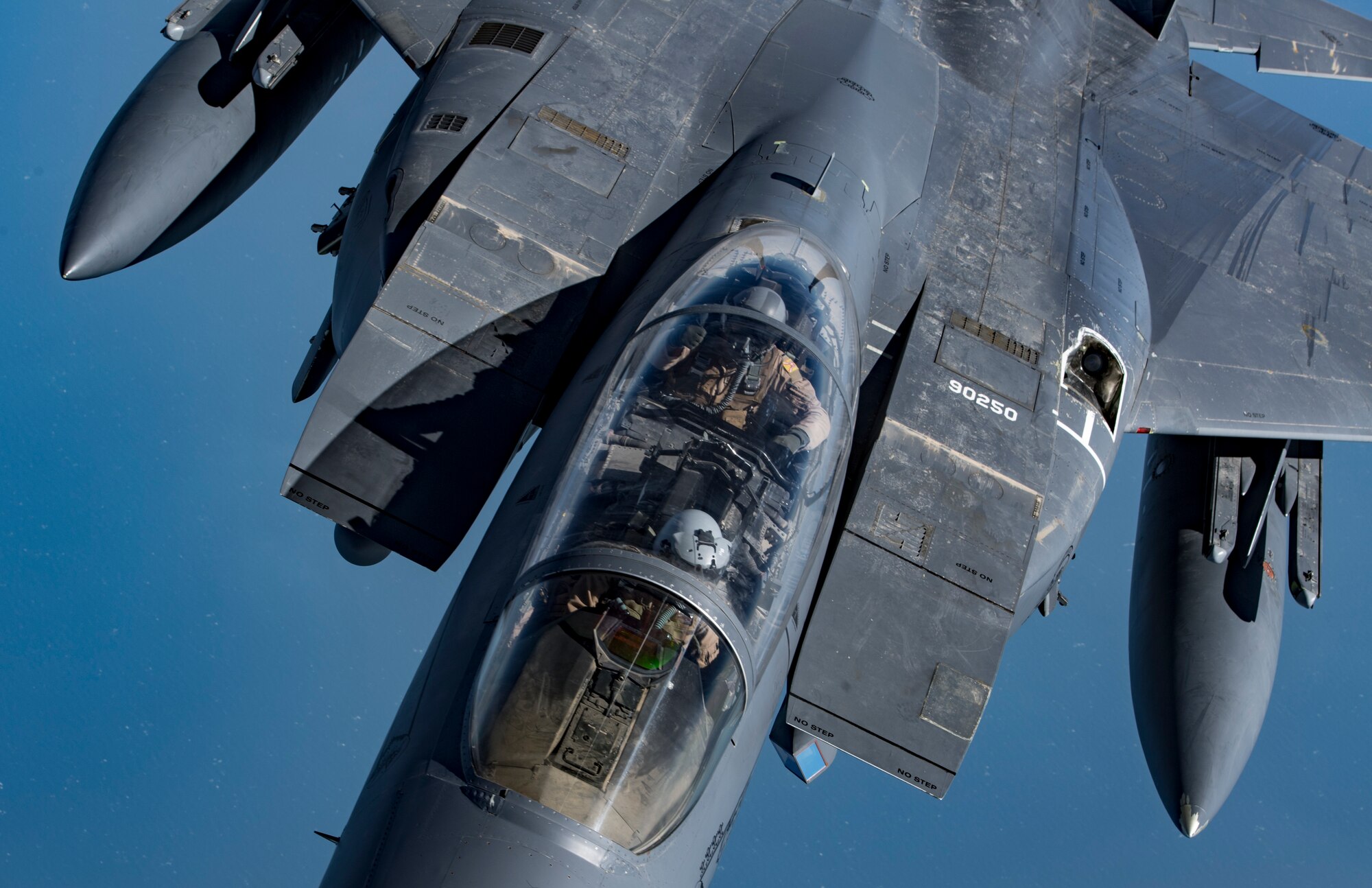 A weapon systems officer gives a “thumbs-up” in a U.S. Air Force F-15E Strike Eagle after aerial refueling provided by a KC-135 Stratotanker during Joint Air Defense Exercise 19-01, Feb. 19, 2019. The aircraft participated with regional partners to test objective-based command and control actions during the exercise. (U.S. Air Force photo by Staff Sgt. Clayton Cupit)