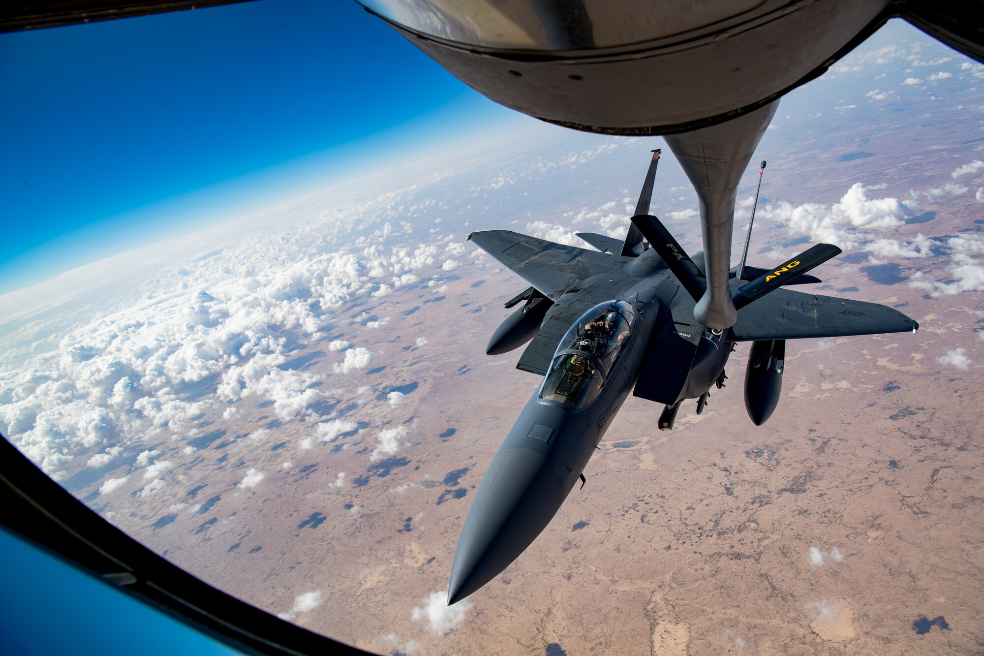 A U.S. Air Force F-15E Strike Eagle maneuvers into position to receive fueled from a KC-135 Stratotanker as a part of Joint Air Defense Exercise 19-01, Feb. 19, 2019. The aircraft participated with regional partners to test objective-based command and control actions during the exercise. (U.S. Air Force photo by Staff Sgt. Clayton Cupit)