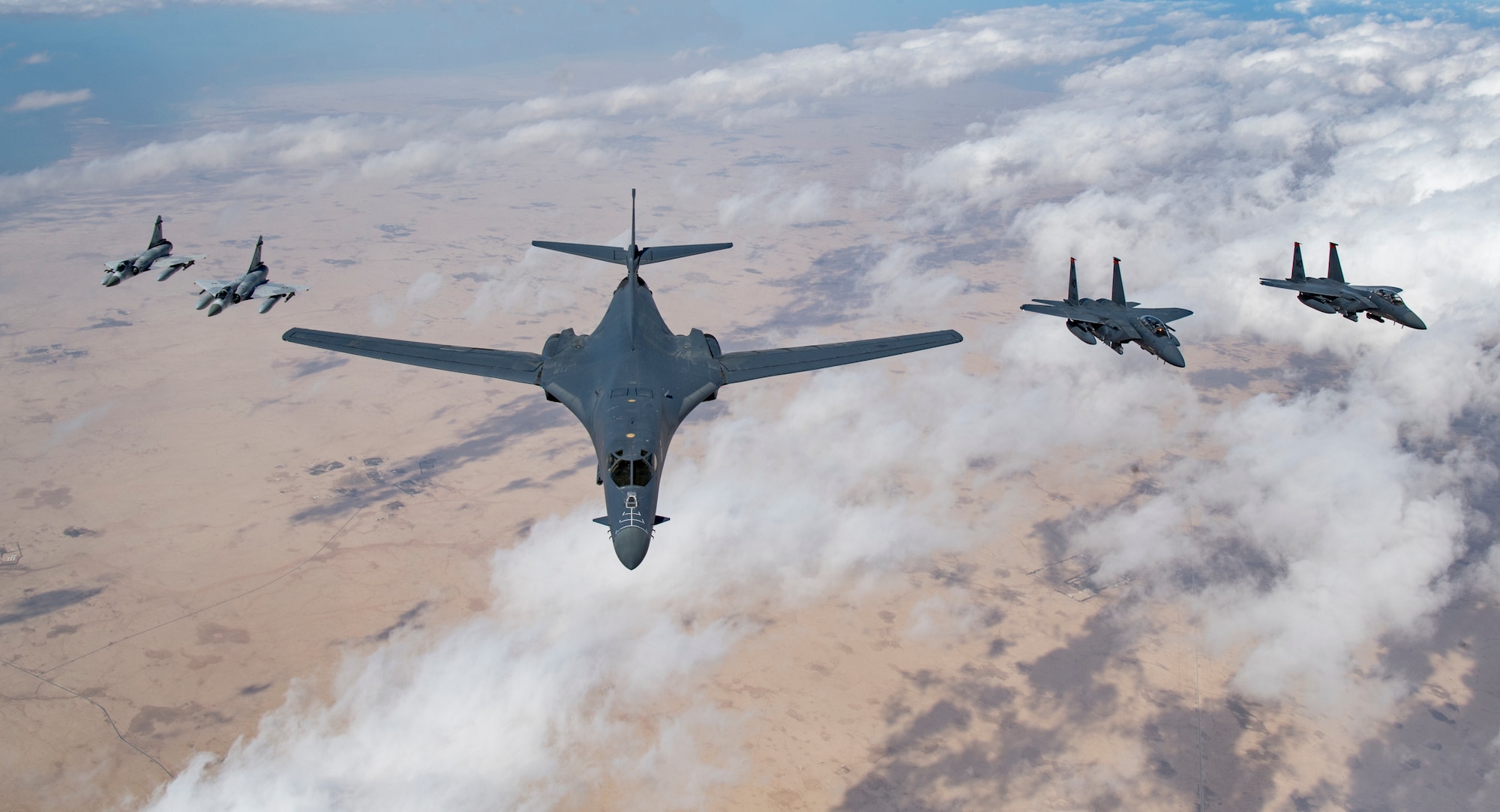 Qatari Mirage 2000s, a U.S. Air Force B-1B Lancer bomber and F-15E Strike Eagles fly in formation during Joint Air Defense Exercise 19-01, Feb. 19, 2019. JADEX provides an opportunity to strengthen military-to-military relationships with the Qatari Air Force while conducting combined air operations with partners. (U.S. Air Force photo by Staff Sgt. Clayton Cupit)
