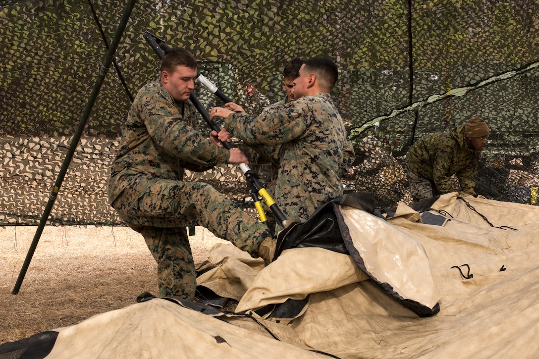 U.S. Marines with Headquarters Battalion, 2nd Marine Division, set up a combat operations center during Tent Exercise 1-19 on Camp Lejeune, N.C., Feb. 4-15, 2019. The two-week-long exercise tested 2nd Marine Division's ability to rapidly break down and re-establish a combat operations center in a field environment, which is essential to the effectiveness and survivability of the command element. (U.S. Marine Corps photo by Cpl. Liah A. Smuin)