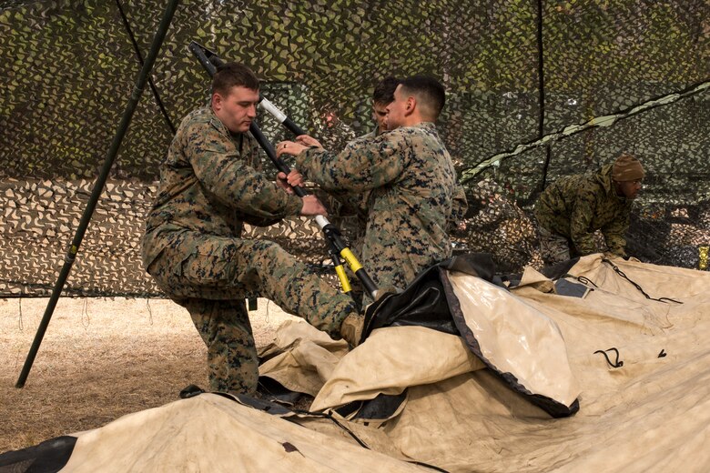 U.S. Marines with Headquarters Battalion, 2nd Marine Division, set up a combat operations center during Tent Exercise 1-19 on Camp Lejeune, N.C., Feb. 4-15, 2019. The two-week-long exercise tested 2nd Marine Division's ability to rapidly break down and re-establish a combat operations center in a field environment, which is essential to the effectiveness and survivability of the command element. (U.S. Marine Corps photo by Cpl. Liah A. Smuin)