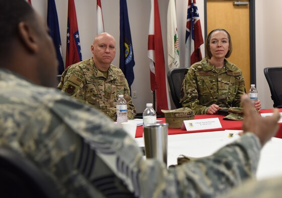 U.S. Air Force Chief Master Sgt. Terry Harris, 338th Training Squadron superintendent, briefs the 338th TRS mission and capabilities during the 81st Training Group mission brief to Chief Master Sgt. Juliet Gudgel, Air Education and Training Command command chief, as Chief Master Sgt. David Pizzuto, 81st Training Wing command chief, listens on inside the Levitow Training Support Facility during Gudgel's base immersion tour at Keesler Air Force Base, Mississippi, Feb. 15, 2019. The 338th TRS training focuses on radio frequency transmission, airfield systems, ground radar, and cyber transport. Throughout the three-day tour, Gudgel received 2nd Air Force and 81st Training Wing mission briefings, ate breakfast with Airmen in training, received an 81st Security Forces Squadron military working dog demonstration and served as the guest speaker for the Chief Master Sergeant Induction Ceremony. Gudgel toured the base to immerse herself in the training missions carried out in support of the command's effort to produce more agile and capable Airmen for the 21st Century. (U.S. Air Force photo by Kemberly Groue)