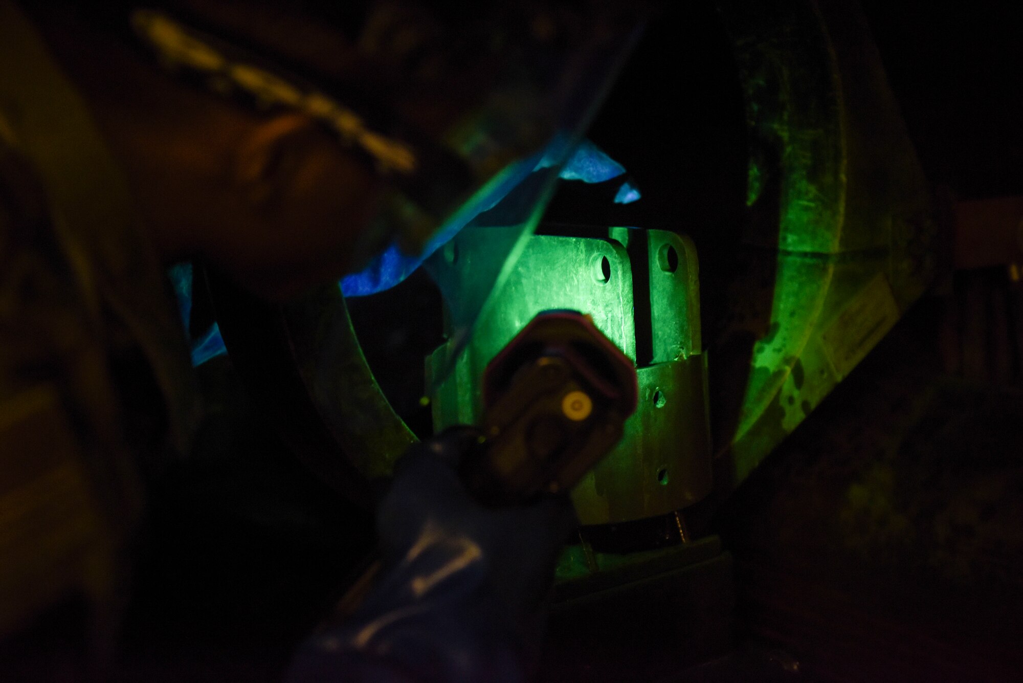 U.S. Air Force Airman 1st Class Clarence Bennett, 100th Maintenance Squadron non-destructive inspection apprentice, performs a magnetic particle inspection on a sample part, at RAF Mildenhall, England, Feb. 7, 2019. Magnetic particle inspections identify stress fatigue fractures on a high variety of parts, varying from bolts, tow bars and other supporting aerospace ground equipment. (U.S. Air Force photo by Airman 1st Class Alexandria Lee)