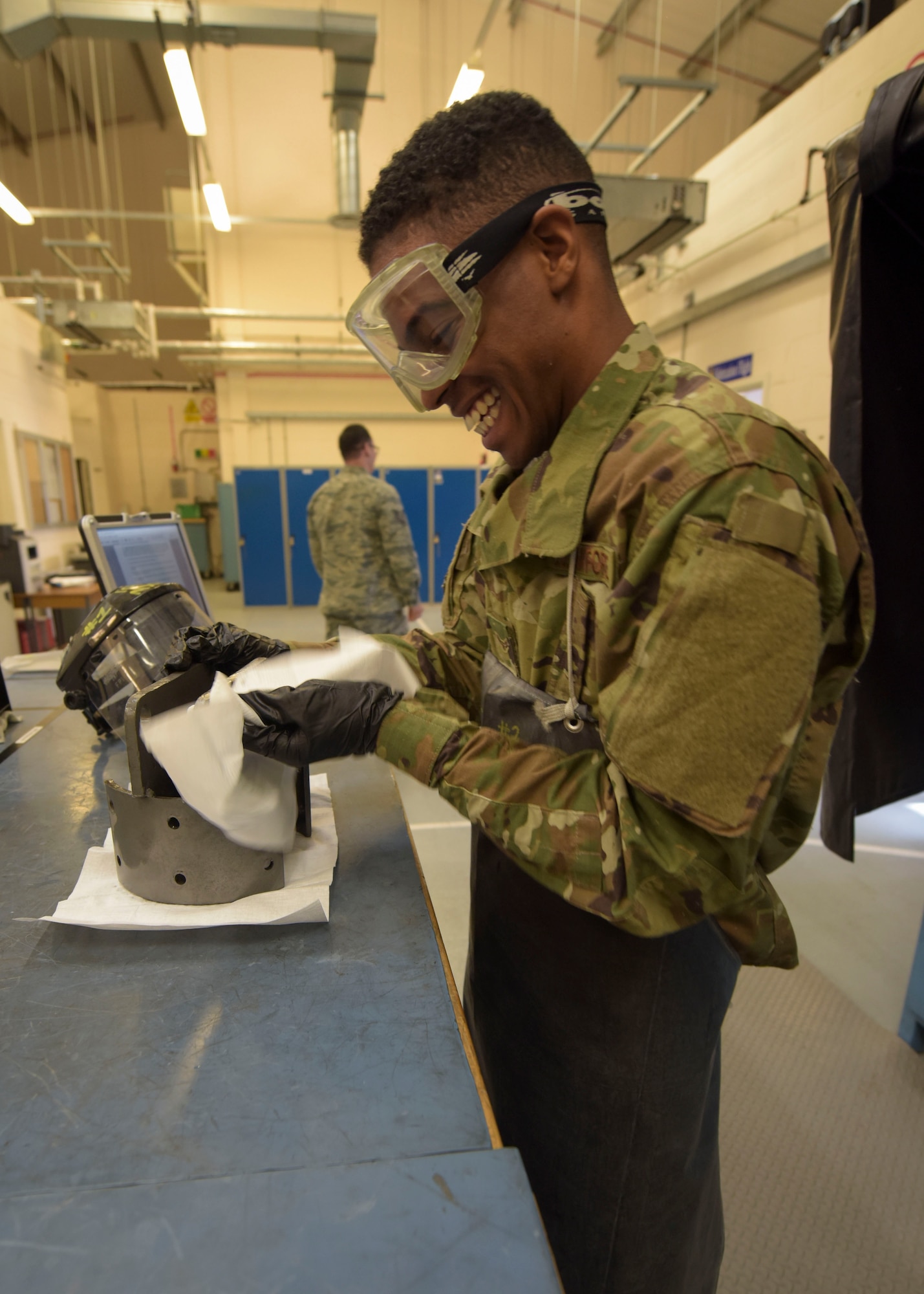 U.S. Air Force Airman 1st Class Clarence Bennett, 100th Maintenance Squadron non-destructive inspection apprentice, performs a magnetic particle inspection on sample part, at RAF Mildenhall, England, Feb. 7, 2019. The magnetic particle inspection is used to look for cracks on welded areas of equipment, varying from bolts, tow bars and other supporting aerospace ground equipment. (U.S. Air Force photo by Airman 1st Class Alexandria Lee)