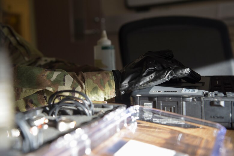 U.S. Air Force Airman 1st Class Clarence Bennett, 100th Maintenance Squadron non-destructive inspection apprentice, calibrates an ultrasonic unit to varying shim sizes testing thickness at RAF Mildenhall, England, Feb. 7, 2019. A shim is a piece of plastic or metal that is used as a reference standard for how thick the area is being tested. (U.S. Air Force photo by Airman 1st Class Alexandria Lee)