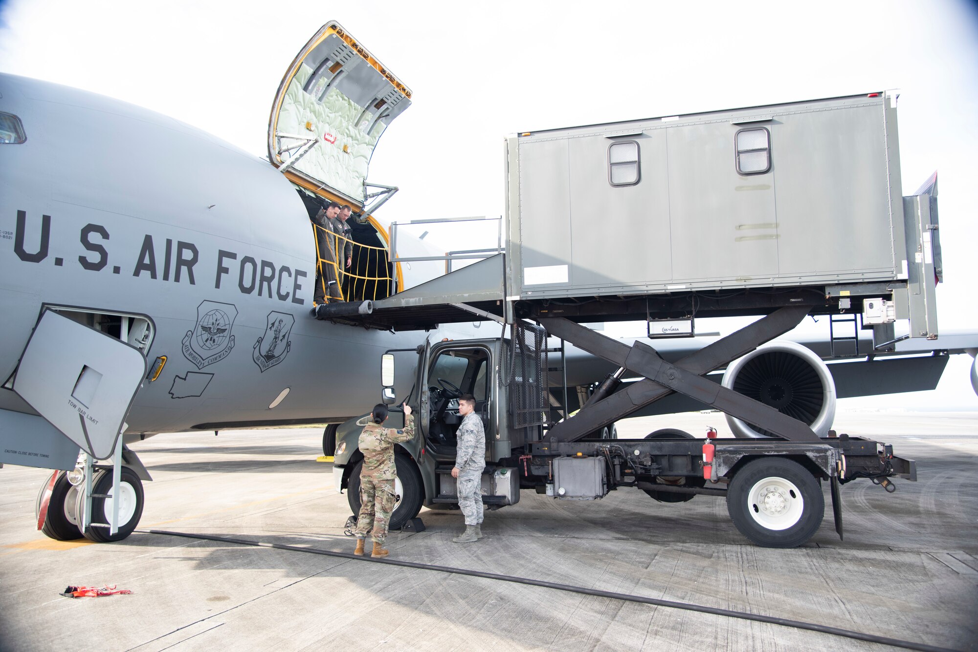U.S. Air Force Staff Sgt. Justin Cagle, 18th Aeromedical Evacuation Squadron AE technician, directs medical elevator truck Airmen prior to loading medical equipment onto a 384th Air Refueling Squadron KC-135 Stratotanker during an AE exercise near Kadena Air Base, Japan, Feb. 19, 2019. These trucks are a cross between an ambulance and elevator, and are necessary to safely delivering critical care patients and medical equipment onto aircraft. (U.S. Air Force photo by Senior Airman Ryan Lackey)