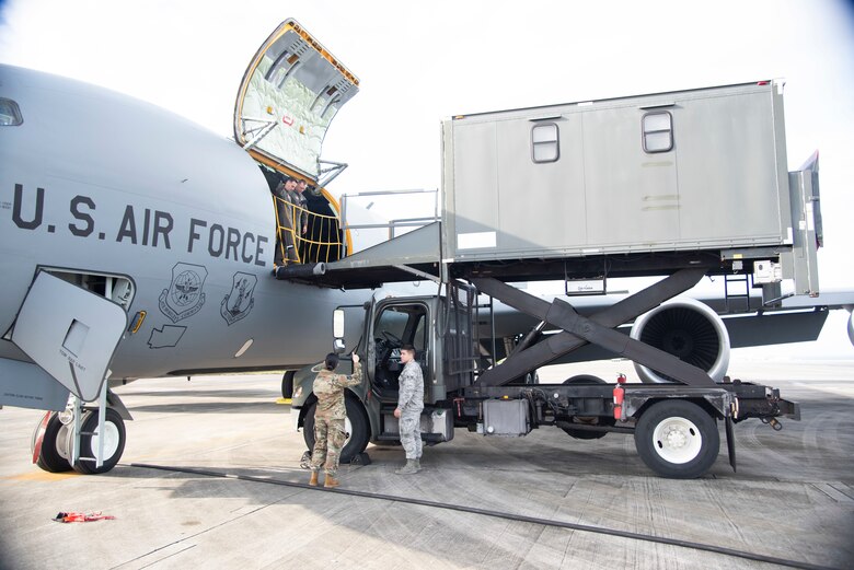 U.S. Air Force Staff Sgt. Justin Cagle, 18th Aeromedical Evacuation Squadron AE technician, directs medical elevator truck Airmen prior to loading medical equipment onto a 384th Air Refueling Squadron KC-135 Stratotanker during an AE exercise near Kadena Air Base, Japan, Feb. 19, 2019. These trucks are a cross between an ambulance and elevator, and are necessary to safely delivering critical care patients and medical equipment onto aircraft. (U.S. Air Force photo by Senior Airman Ryan Lackey)
