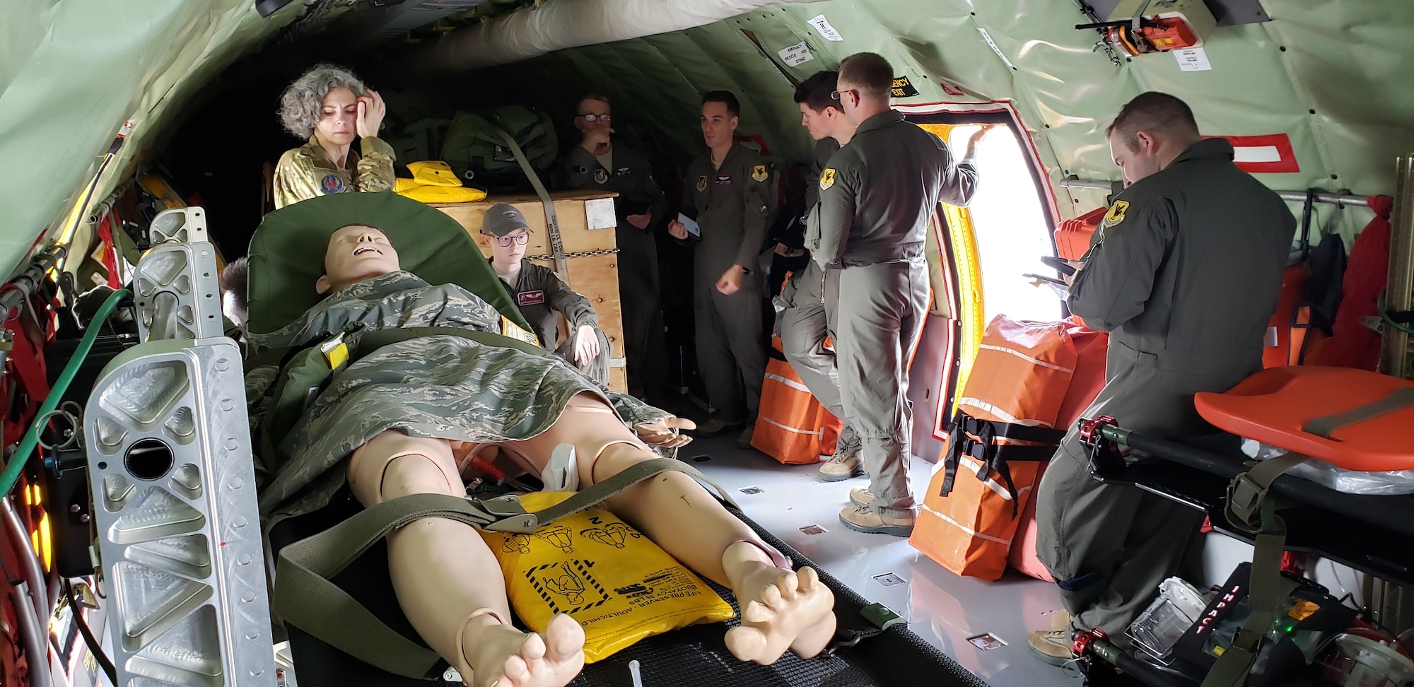 Airmen from the 384th Air Refueling Squadron and 18th Aeromedical Evacuation Squadron pause after completing set-up and loading of a KC-135 Stratotanker for a AE exercise near Kadena Air Base, Japan, Feb. 19, 2019. While pilots are in charge of flying a KC-135, refueling boom operators are in charge of the rest of the aircraft, which can be fitted for cargo, passenger transport or medical support. (U.S. Air Force photo by Senior Airman Ryan Lackey)