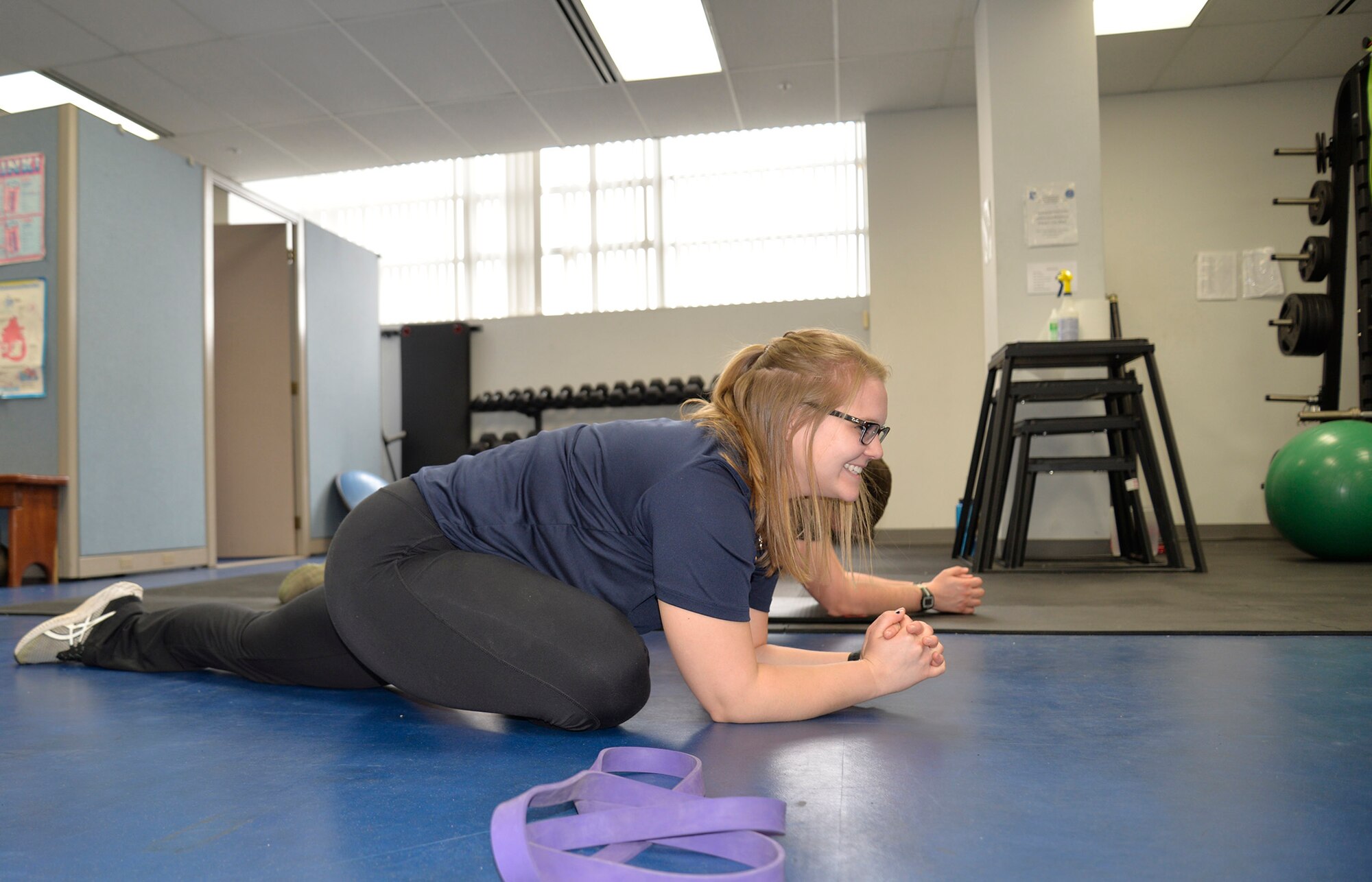 Hannah Kohne, a contractor at the 711th Human Performance Wing, takes Staff Sgt. Alan Gagnon through a stretching routine as a part of the Function Bridge Fitness Study at Wright Patterson Air Force Base, Feb. 14th, 2019.