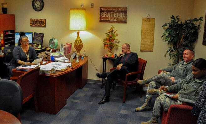 Employees at the Equal Opportunity Office gather for a staff meeting, Wright-Patterson Air Force Base, Ohio, Feb. 19.