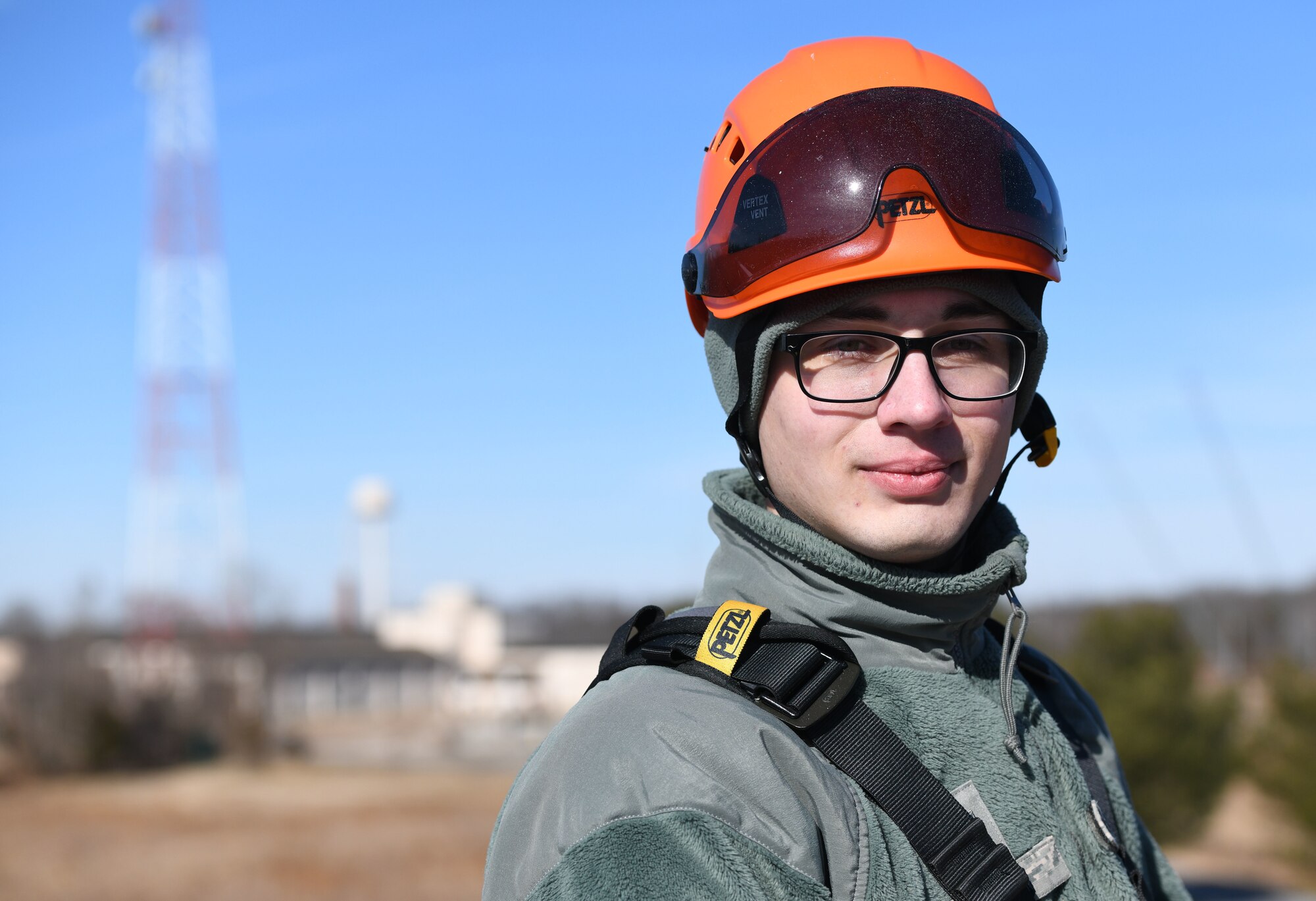 Airman with tower behind him