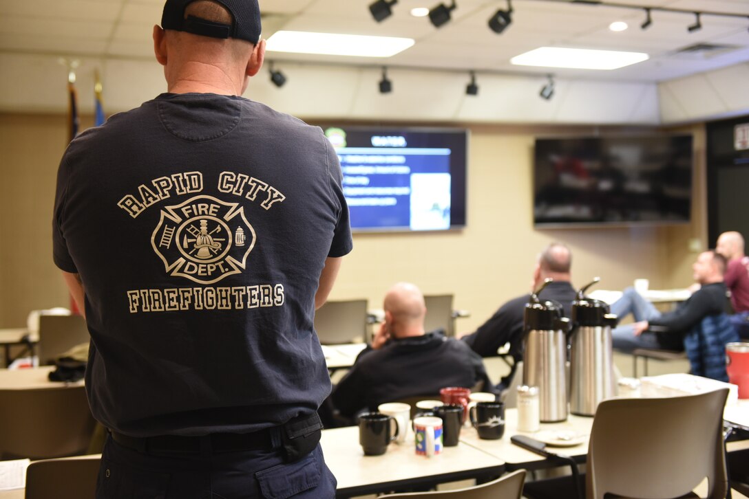 Airmen from the 28th Civil Engineer Squadron Fire Protection Flight learn the principles of ice rescue in the Rapid City Fire Department’s classroom in Rapid City, S.D., Feb. 12, 2019. Before heading out to Canyon Lake, Airmen learned aboutthe different tools and correct procedures needed to perform an ice rescue. (U.S. Air Force photo by Senior Airman Michella Stowers)