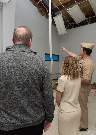 Rep. Debbie Wasserman Schultz and Rep. Neal Dunn tour hurricane damaged buildings during a visit to the Naval Support Activity Panama City Feb. 19, 2019.