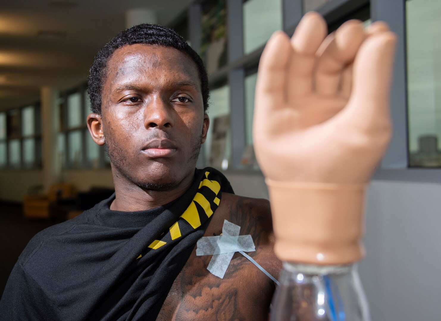 U.S. Army Staff Sgt. Kayshawn Porterfield practices using a myoelectric prosthesis at Brooke Army Medical Center’s Center for the Intrepid, Joint Base San Antonio-Fort Sam Houston Feb. 21. A myoelectric-controlled prosthesis is an externally powered artificial limb that the user controls with electrical signals generated naturally with his own muscles.