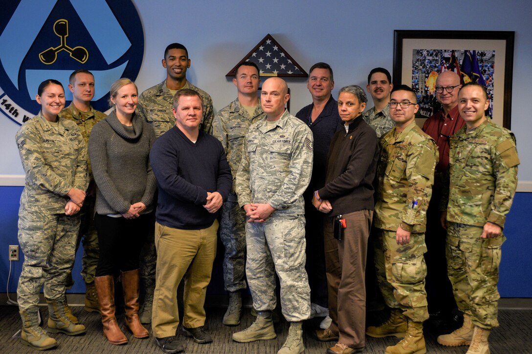 Members of the 14th Weather Squadron Climate Go-Kit development team pose for a group photo at their Asheville, North Carolina, office Jan. 31, 2019. By utilizing in-house resources, the development team was able to build the go-kit system in approximately six months, saving approximately $128,000 versus outsourcing the development. (U.S. Air Force photo by Staff Sgt. Charles Buckler)