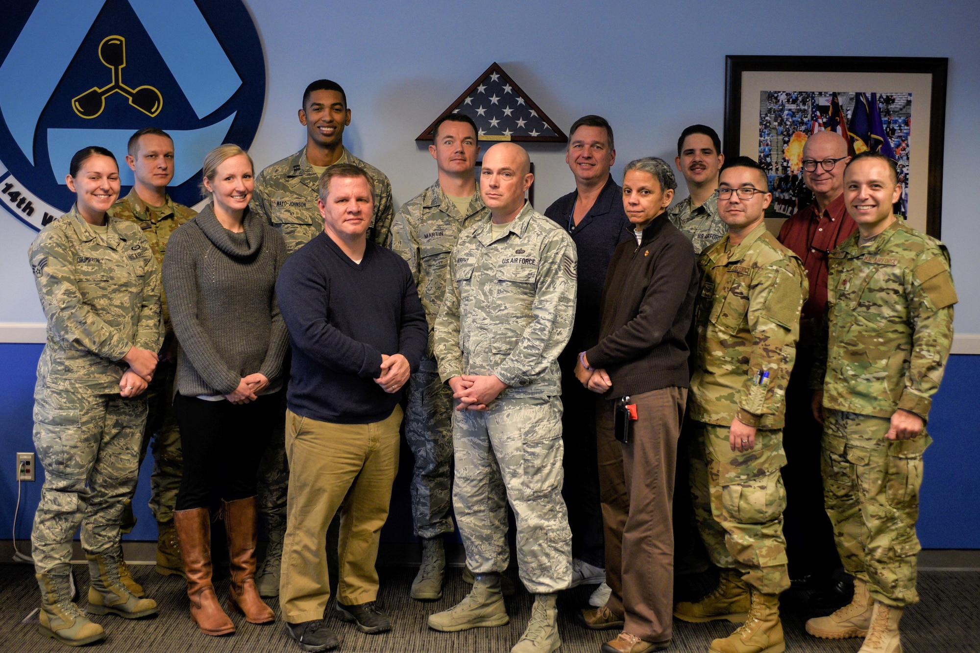 Members of the 14th Weather Squadron Climate Go-Kit development team pose for a group photo at their Asheville, North Carolina, office Jan. 31, 2019. By utilizing in-house resources, the development team was able to build the go-kit system in approximately six months, saving approximately $128,000 versus outsourcing the development. (U.S. Air Force photo by Staff Sgt. Charles Buckler)