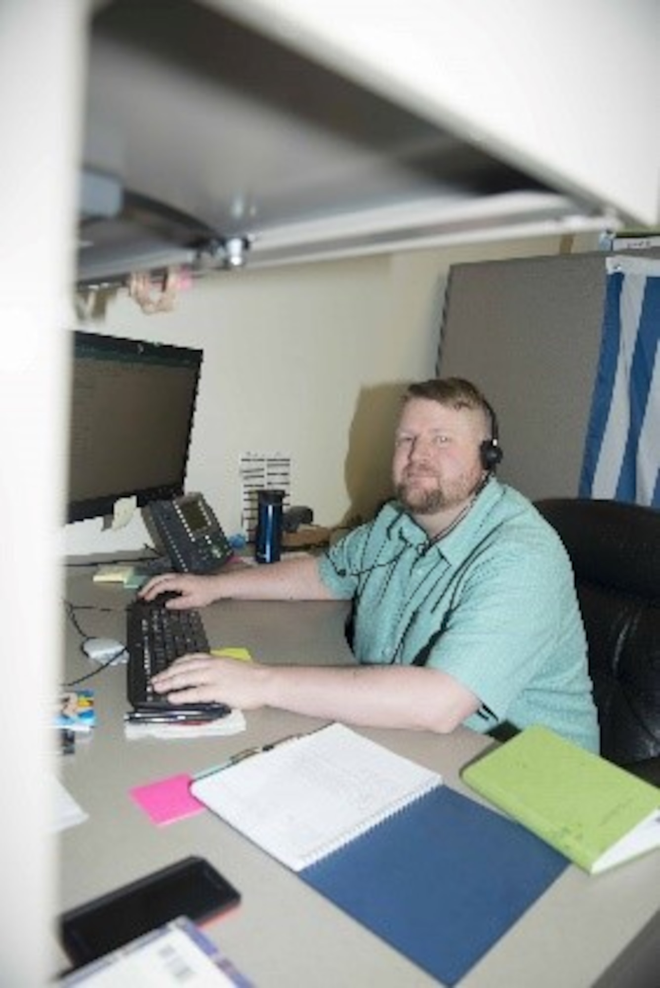 Charles Bishop, 20th Communication Squadron client service technician, sits at his office desk at the CS, at Shaw Air Force Base S.C Jan. 31, 2019.