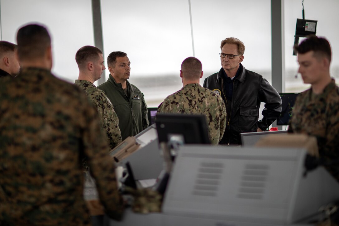 Honorable Mr. Thomas B. Modly, the Undersecretary of the Navy, speaks with Marines and sailors from Marine Corps Air Station Miramar about future projects on the flight line at MCAS Miramar, Calif., Feb. 15. Modly visited MCAS Miramar to learn about current and future projects being conducted on the installation as well as what it takes to support the joint force from San Diego. (U.S. Marine Corps photo by Sgt. Jake McClung)