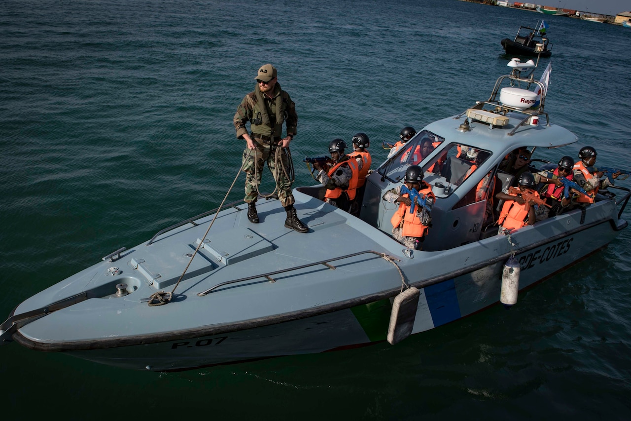 Sailors on board a boat.