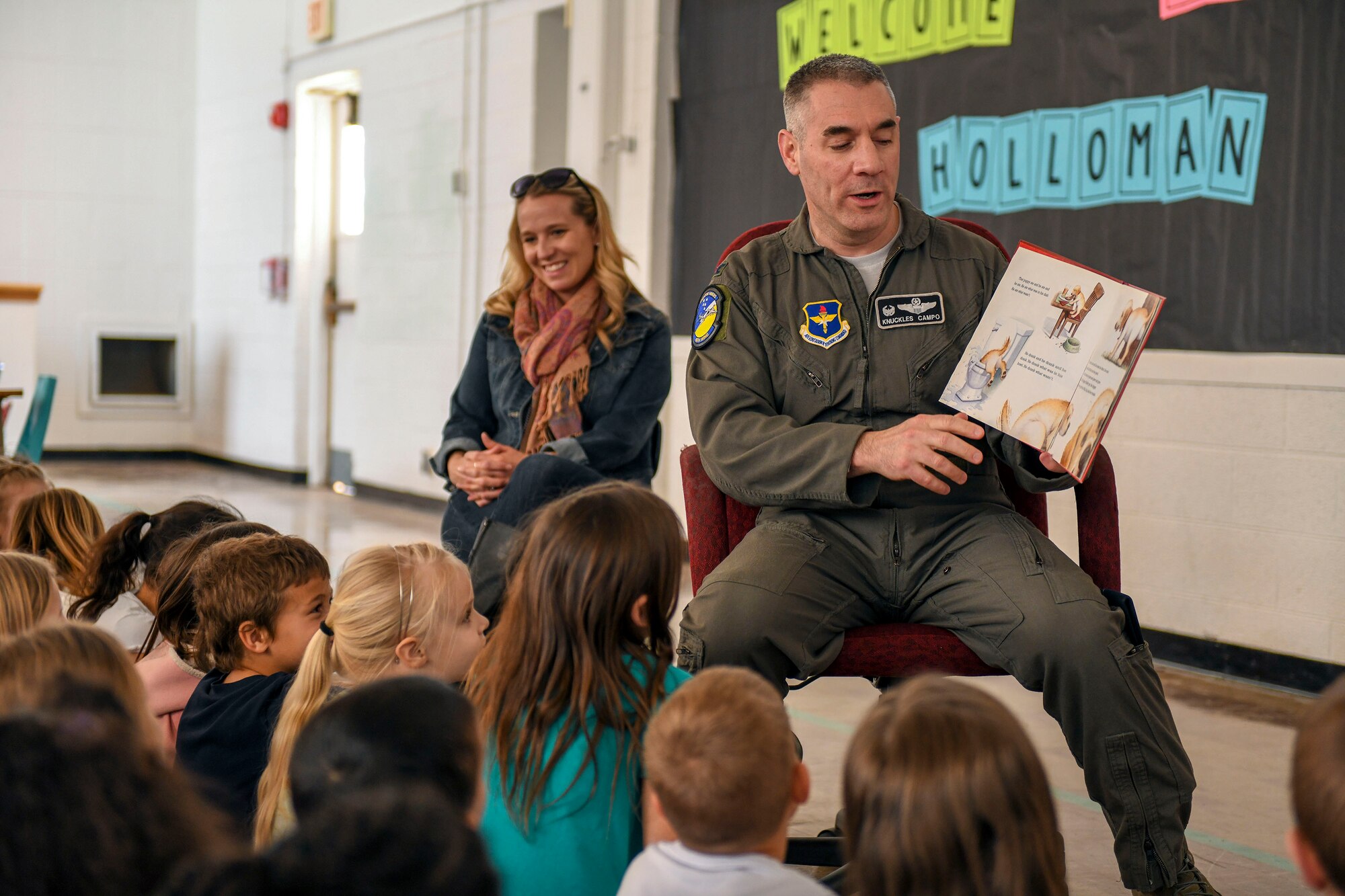 Col. Joseph Campo, 49th Wing commander, reads to children at Holloman Elementary School, Feb. 21, 2019, on Holloman Air Force Base, N.M. Campo read to the children as he was selected as this month’s ‘mystery reader.’ (U.S. Air Force photo by Staff Sgt. Christine Groening)