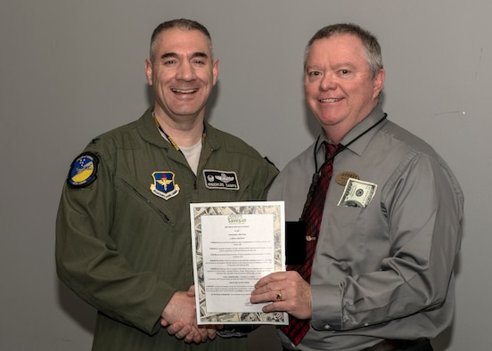Col. Joseph Campo, 49th Wing commander, poses for a photo with Bruce Knee, 49th Force Support Squadron’s Airman and Family Readiness Center community readiness consultant and personal financial manager, Feb. 20, 2019, on Holloman Air Force Base, N.M. Campo signed the Military Saves Week 2019 proclamation, kick starting an educational week of financial readiness and success. (U.S. Air Force photo by Airman 1st Class Kindra Stewart)