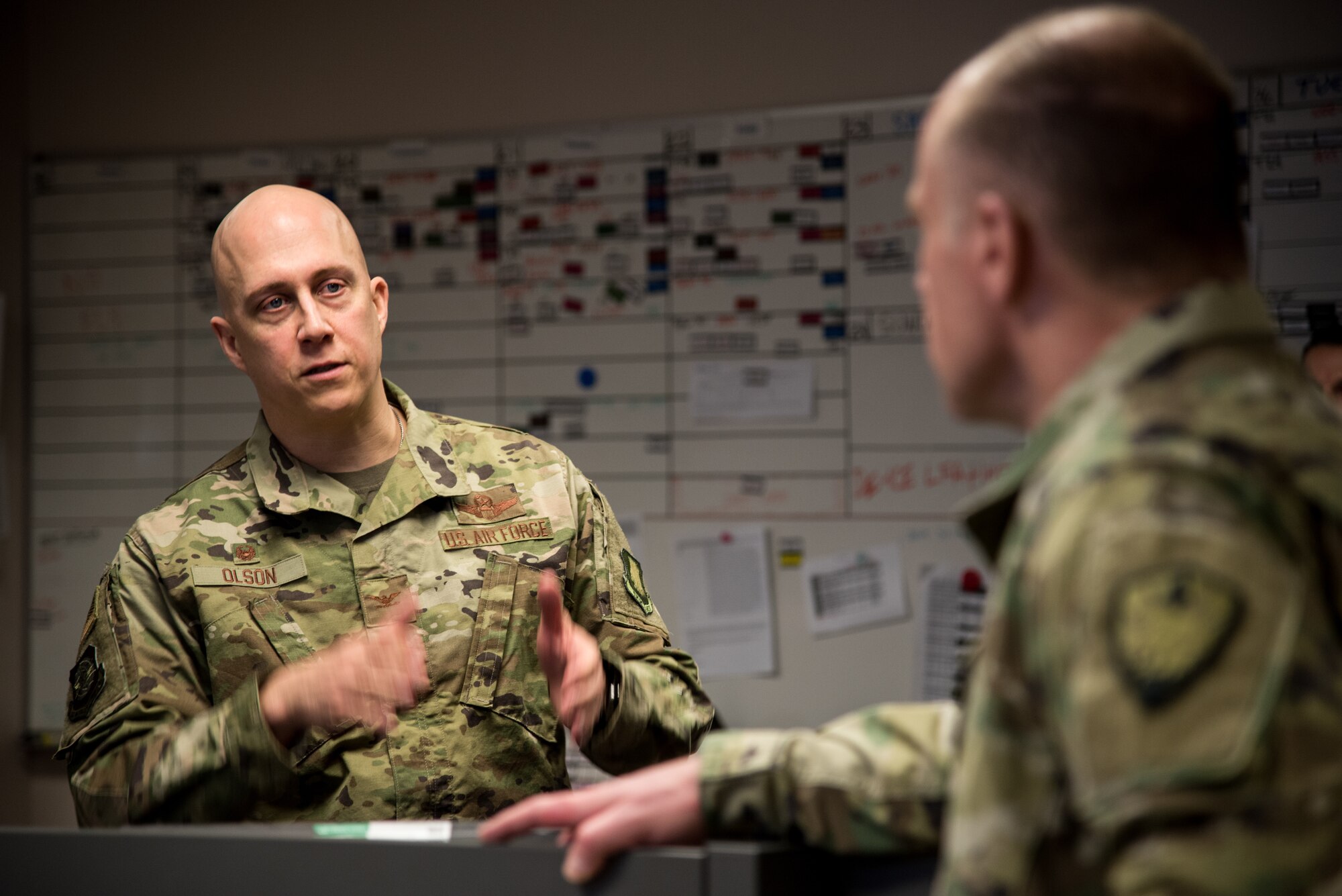 Col. Josh Olson, 22 Air Refueling Wing commander, speaks to U.S. Army Gen. Stephen R. Lyons, U.S. Transportation Command commander, Feb. 21, 2019, at McConnell Air Force Base, Kan. During the visit, Lyons was briefed on McConnell’s operations, readiness and what the installation provides to the USTRANSCOM. (U.S. Air Force photo by Airman 1st Class Alan Ricker)
