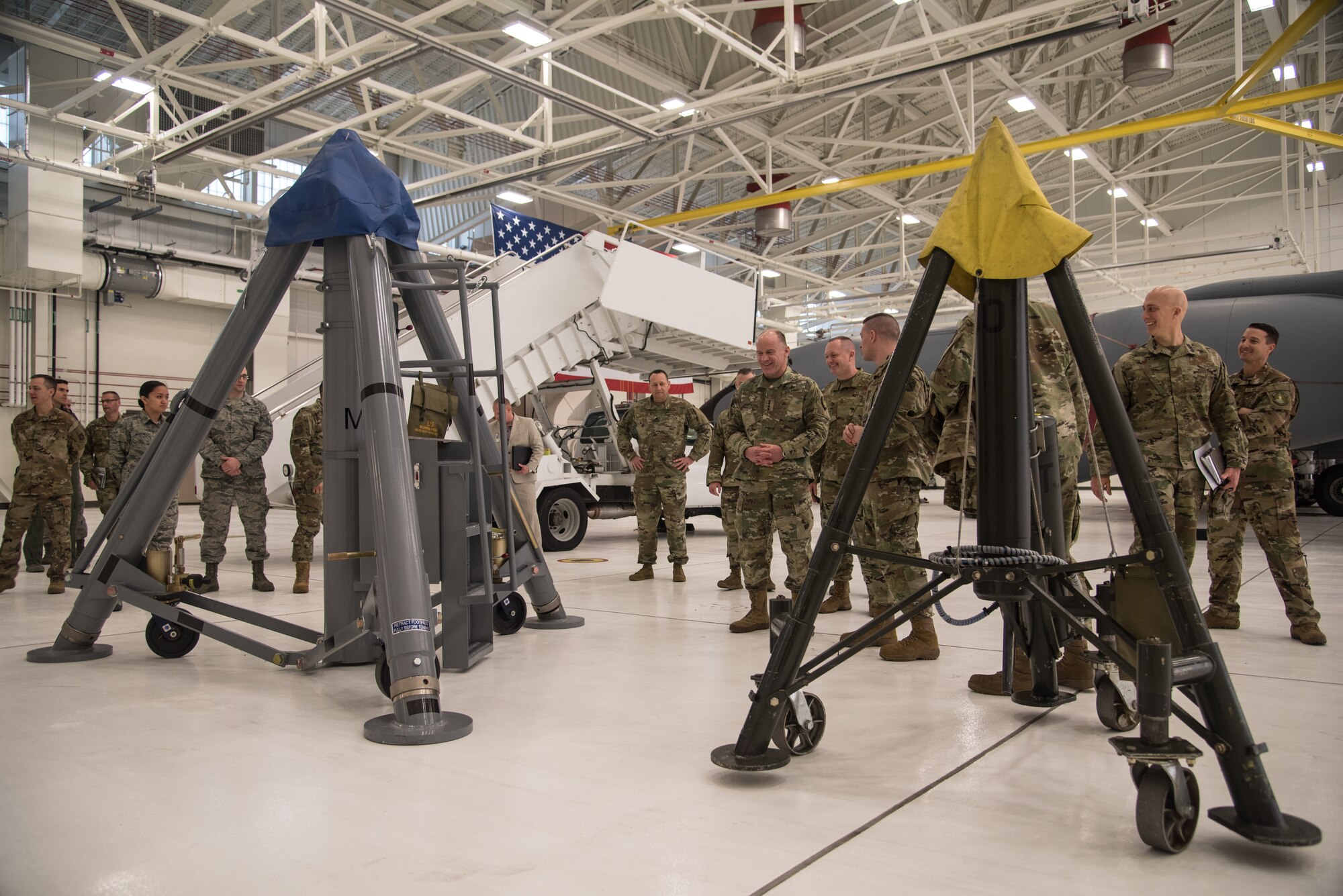 Michael Walsh, 22nd Maintenance Squadron aerospace ground equipment section lead, briefs U.S. Army Gen. Stephen R. Lyons, U.S. Transportation Command commander, Feb. 21, 2019, at McConnell Air Force Base, Kan. Walsh explained that braces were manufactured to provide an umbrella-like motion to the KC-46A Pegasus aircraft jacks to help their mobilization. (U.S. Air Force photo by Airman 1st Class Alan Ricker)