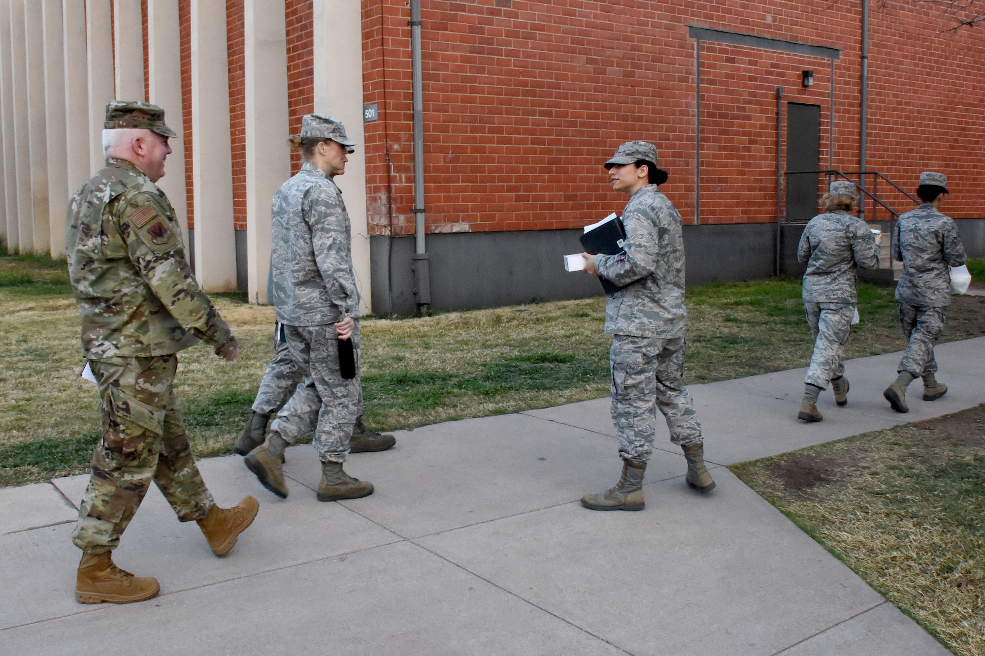 U.S. Air Force 2nd Lt. Jennifer Dees, 17th Training Wing action officer, guides senior Intelligence, Surveillance and reconnaissance officers to one of four Learning Next stations across the 17 Training Group campus on Goodfellow Air Force Base, Texas, Feb. 7, 2019. The officers visited Goodfellow to witness the new training that the Air Force has implemented. (U.S. Air Force photo by Senior Airman Seraiah Hines/Released)
