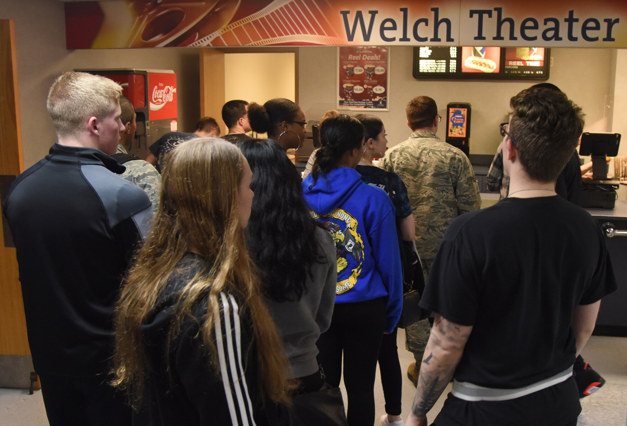 Airmen from the 81st Training Group stand in line for refreshments to watch the movie, 42, inside the Welch Theater at Keesler Air Force Base, Mississippi, Feb. 21, 2019. The movie, a story of Jackie Robinson's rise to fame in Major League Baseball, was shown in celebration for Black History Month. Keesler hosted several events throughout the month to include a 5K run, luncheon, movies and will conclude with a close-out celebration Feb. 28. The events are meant to help Keesler personnel to remember, educate and celebrate black history. (U.S. Air Force photo by Kemberly Groue)