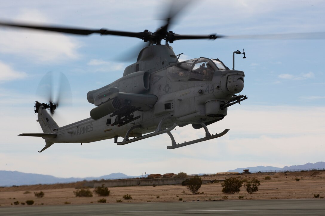 An AH-1Z with Marine Light Attack Helicopter Squadron (HMLA) 369, Marine Aircraft Group (MAG) 39, 3rd Marine Aircraft Wing (MAW), takes off during a training exercise at Marine Corps Air Ground Combat Center (MCAGCC) Twentynine Palms, Calif., Feb. 15. In a dynamic display of strength, MAG-39, launched 82 attack, utility and assault support aircraft. Maintainers and ground support crews watched with pride and a strong sense of accomplishment as each of their aircraft fulfilled its role in formation, took to the sky, then disappeared over the horizon. Over the course of several hours, more than 100 aircraft from MAG-13 and MAG-39 took to the skies over Southern California, proving 3rd MAW’s capability to “Fix, Fly, Fight” and, when needed advance at a moment’s notice. (U.S. Marine Corps photo by Lance Cpl. Julian Elliott-Drouin)