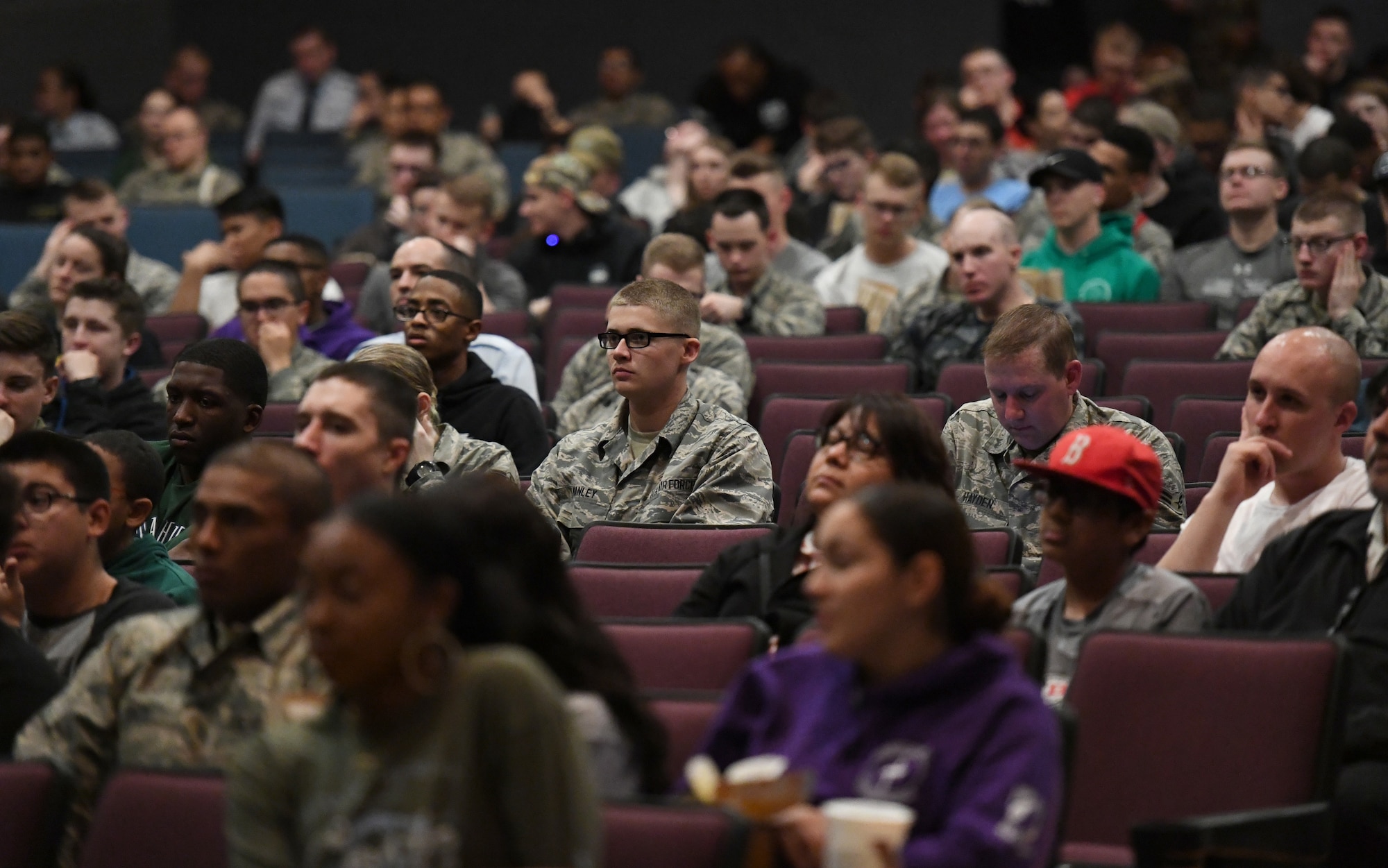 Keesler personnel listen to opening remarks made by Barry Lyons, Biloxi Shuckers Minor League Baseball Team ambassador, prior to the playing of the movie, 42, inside the Welch Theater at Keesler Air Force Base, Mississippi, Feb. 21, 2019. The movie, a story of Jackie Robinson's rise to fame in Major League Baseball, was shown in celebration for Black History Month. Lyons played 14 years of professional baseball to include seven years in the major leagues. Keesler hosted several events throughout the month to include a 5K run, luncheon, movies and will conclude with a close-out celebration Feb. 28. The events are meant to help Keesler personnel to remember, educate and celebrate black history. (U.S. Air Force photo by Kemberly Groue)
