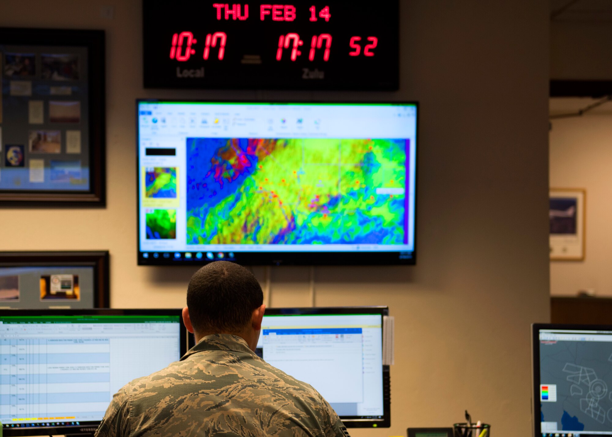 Senior Airman Christopher Smith, 56th Operations Support Squadron Weather Flight journeyman, reviews a forecast at Luke Air Force Base, Ariz., Feb. 14, 2019.
