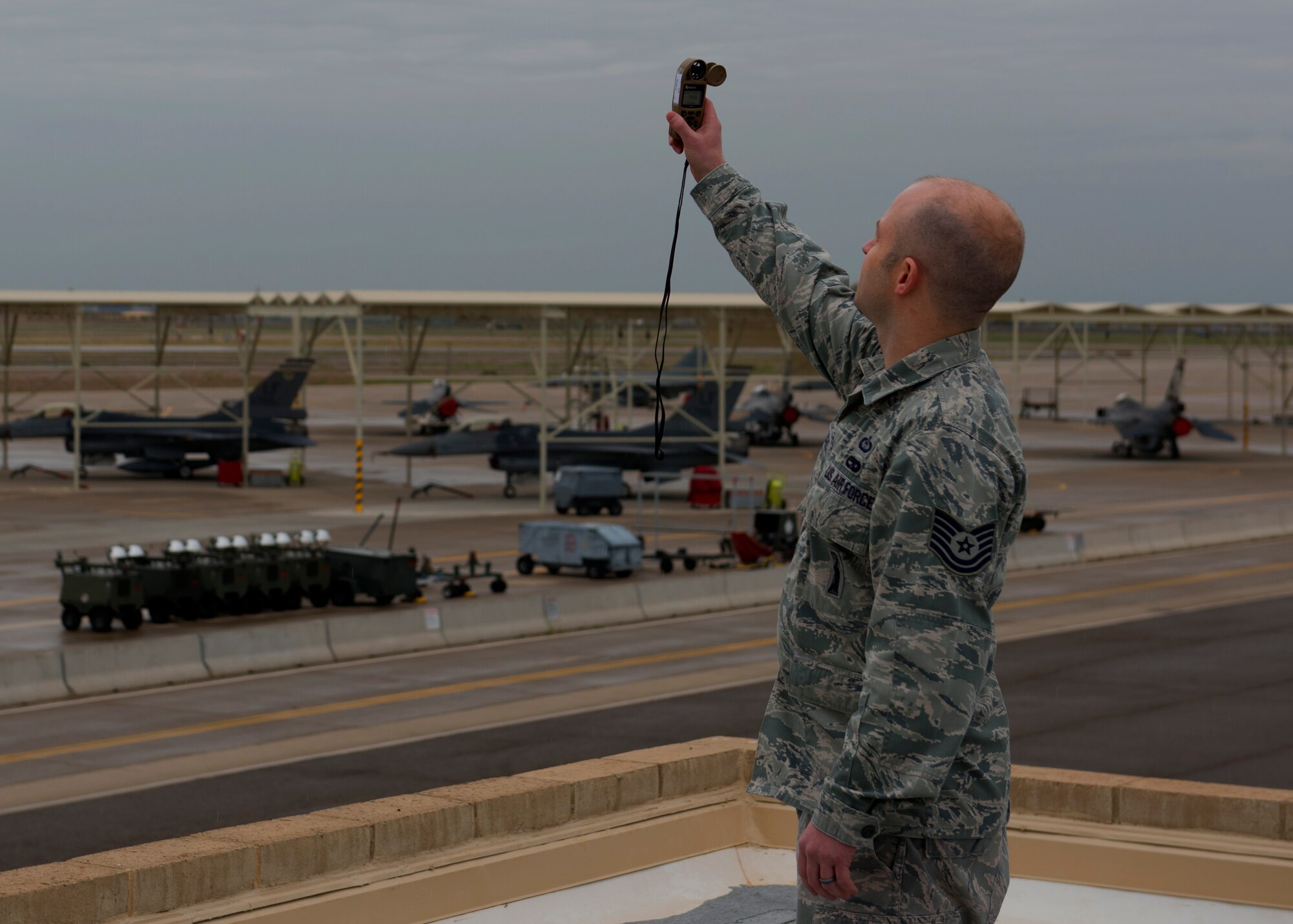 Tech Sgt. Sean Hilliard, 56th Operations Support Squadron Weather Flight craftsman, uses a Kestrel, a handheld wind and weather tracker, at Luke Air Force Base, Ariz., Feb. 14, 2019.