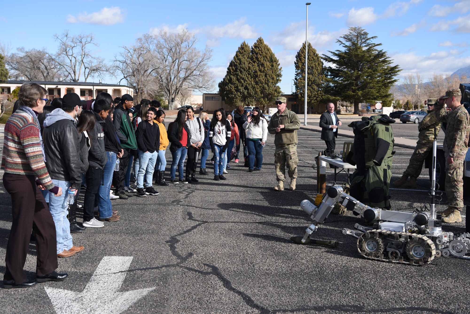 Staff Sgt. Todd Wycoff (center), Kirtland Explosive Ordnance Dispoal, conducts an EOD demo for students from Albuquerque High School here Feb. 21, 2019. The group was taking part in the Job Shadow outreach event. (U.S. Air Force photo by Senior Amn. Eli Chevalier)