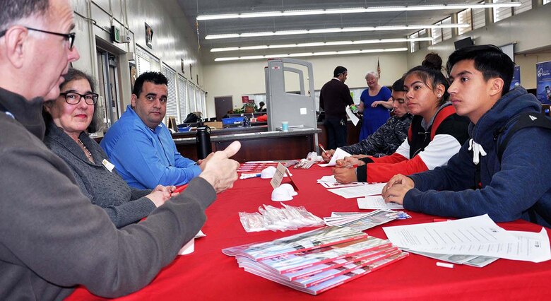 U.S. Army Corps of Engineers Los Angeles District employee Alfonso Quintero, far left, answers a question posed by high school students, while Corps’ employees Raina Fulton, center, and Chadi Wahby, right, listen during John Muir High School’s Engineering and Environmental Science Academy Career Exploration Showcase Day Feb. 13 in Pasadena, California.