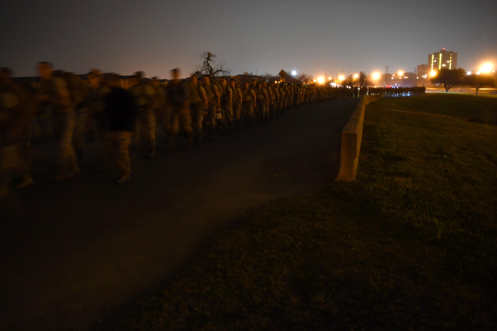 Special Tactics Airmen with the 24th Special Operations Wing lead hundreds of Airmen, trainees, and supporters during the initial five-mile starting leg of the Special Tactics Memorial March Feb. 22, 2019, at Lackland Air Force Base, Texas.