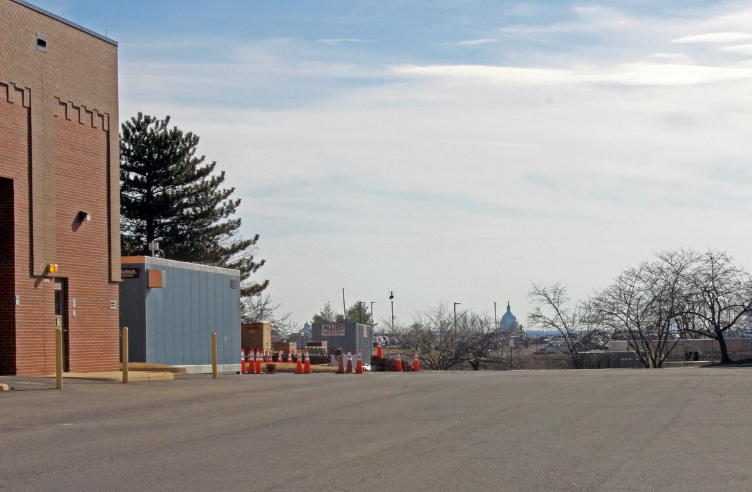 Exterior view of the Advanced Treatment Pilot Study blue trailer at the McMillan Water Treatment Plant, Washington Aqueduct, District of Columbia, Dec. 19, 2018. The U.S. Capitol Building is seen in the background. (U.S. Army photo by Sarah Lazo)