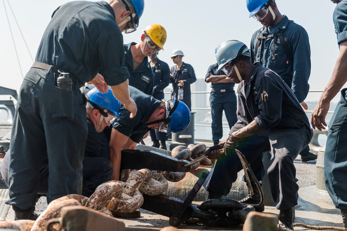 190223-N-WI365-1041 KOTA KINABALU, Malaysia (Feb. 23, 2019) – Deck department Sailors pass the stopper on the anchor chain on the foc’s’le of the amphibious dock landing ship USS Ashland (LSD 48) during a sea and anchor evolution. Ashland, part of the Wasp Amphibious Ready Group, with embarked 31st Marine Expeditionary Unit, is operating in the Indo-Pacific region to enhance interoperability with partners and serve as a ready-response force for any type of contingency. (U.S. Navy photo by Mass Communication Specialist 2nd Class Markus Castaneda)
